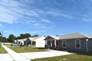 A view of a street and several houses in the Arbor Bend community.