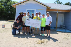PaverScape Inc. volunteers pose for a photo at a Habitat Orlando & Osceola build site.